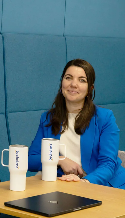 A TechClass colleague in a modern, branded office space