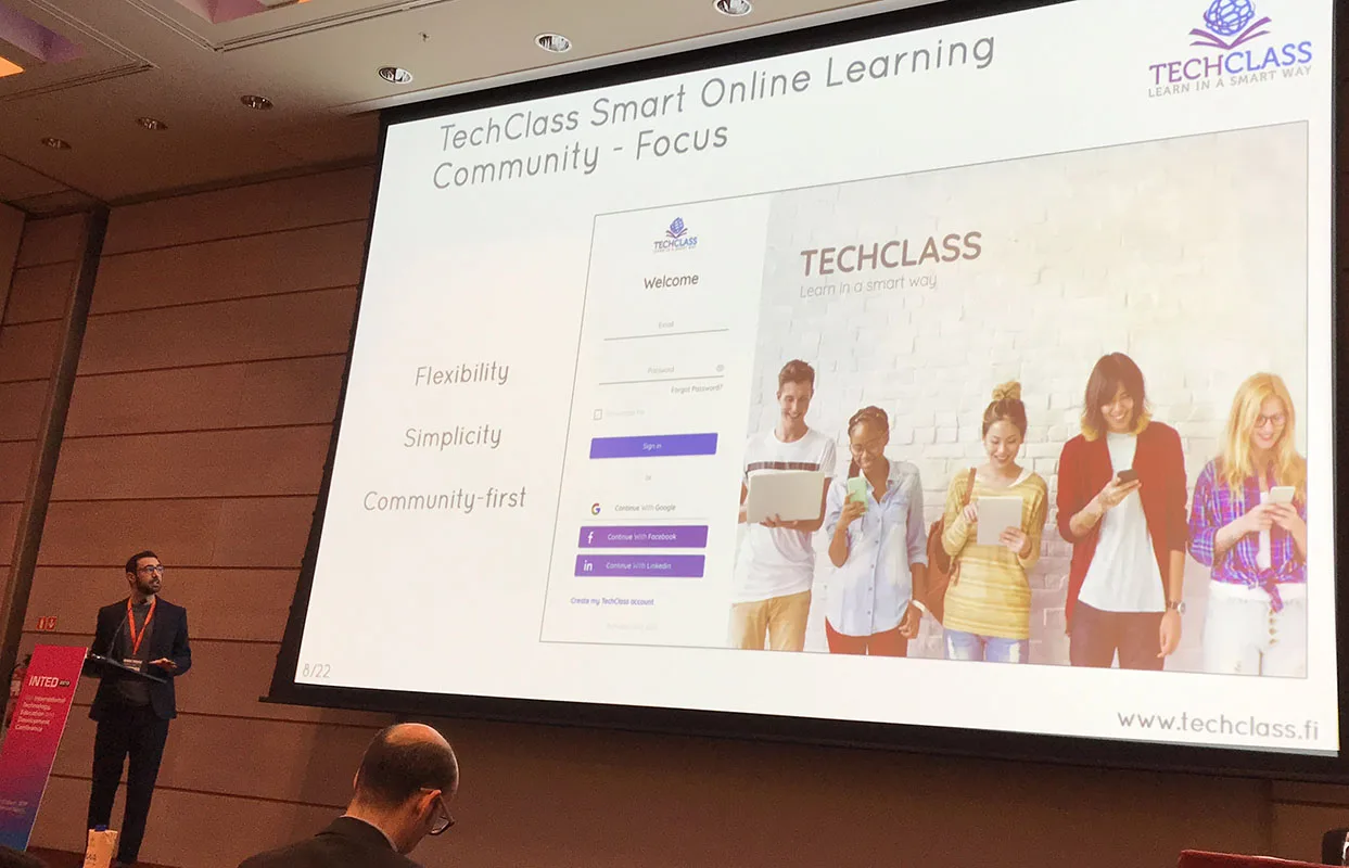 A TechClass presenter leading a research workshop session in front of an audience