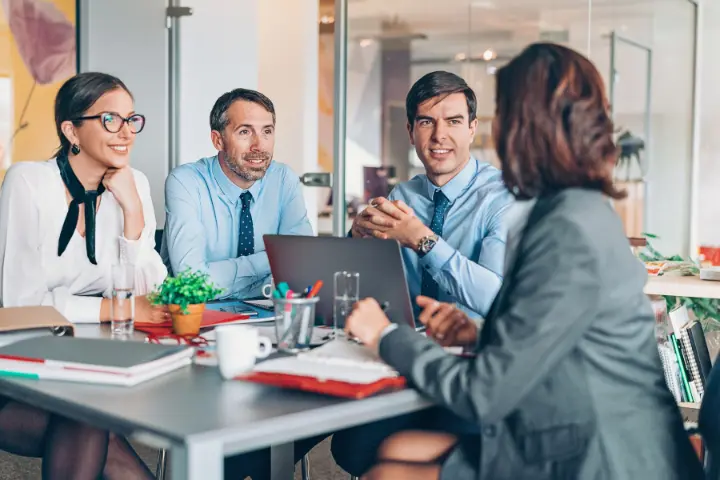 Managers planning their training catalog in a meeting