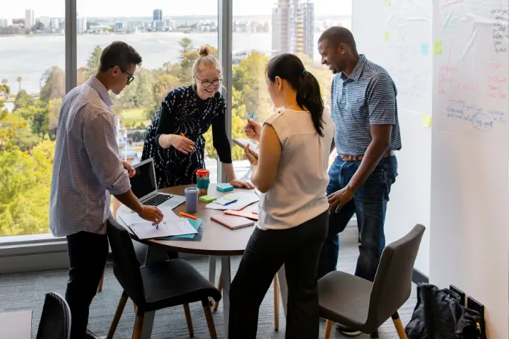 Team working together around a table during a planning session