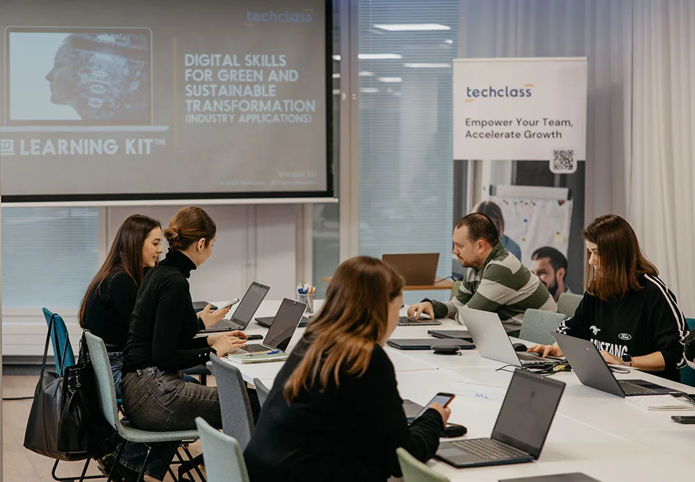 Participants discussing a case study at a TechClass workshop